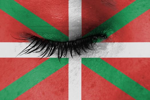 Women eye, close-up, tear, flag of Basque Country