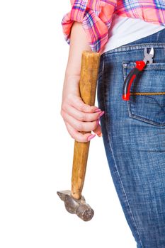 worker stands with his back with hammer in hand