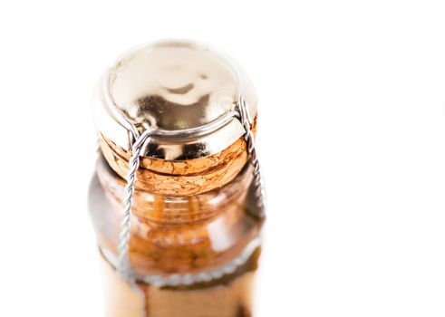 neck of a bottle of champagne close-up isolated on white background
