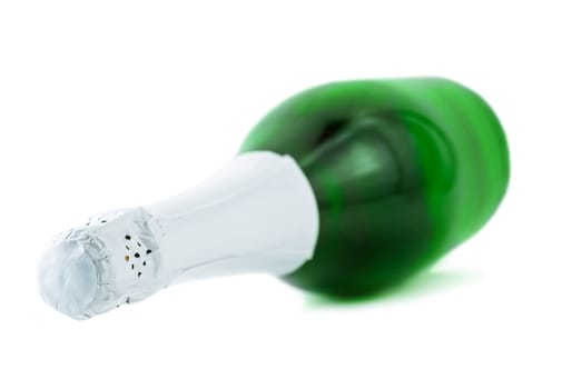 closed bottle of champagne lying on a white background isolated