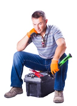 worker is resting sitting on toolbox isolated white background