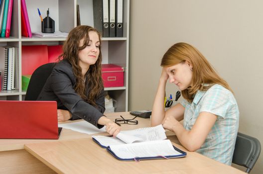Young beautiful girl on reception at the office specialist