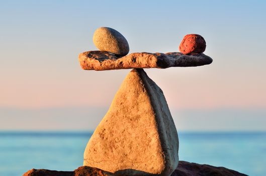Well-balanced stack of pebbles on the shore