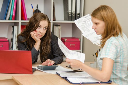 Young beautiful girl on reception at the office specialist