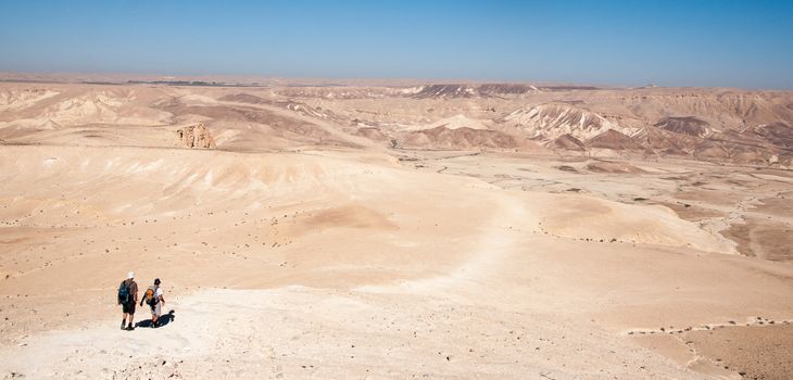 Tourist travel in negev desert of stones and mountains