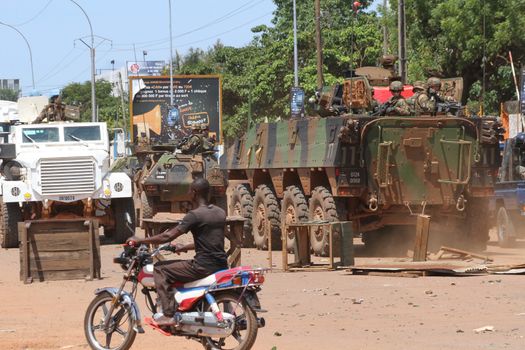 CENTRAL AFRICAN REPUBLIC, Bangui  : Soldiers of the United Nations Multidimensional Stabilization Mission in Central African Republic, Minusca, and french army pass on a street in Bangui, as they patrol in the city, on October 27, 2015,  after protesters attacked and plundered Muslim houses and shops in the aftermath of the murder of at least one clean water delivery man, on October 26. The Central African Republic descended into bloodshed on last September, more than two years ago after long time president Francois Bozize, a Christian, was ousted by Seleka rebels, triggering the worst crisis since independence in 1960. 