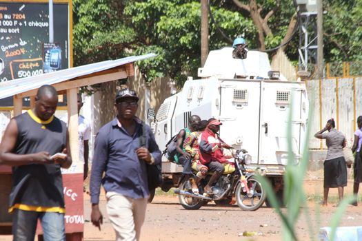 CENTRAL AFRICAN REPUBLIC, Bangui  : Soldiers of the United Nations Multidimensional Stabilization Mission in Central African Republic, Minusca, passe on a street in Bangui, as they patrol in the city, on October 27, 2015,  after protesters attacked and plundered Muslim houses and shops in the aftermath of the murder of at least one clean water delivery man, on October 26. The Central African Republic descended into bloodshed on last September, more than two years ago after long time president Francois Bozize, a Christian, was ousted by Seleka rebels, triggering the worst crisis since independence in 1960. 