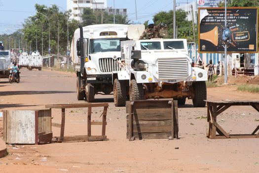 CENTRAL AFRICAN REPUBLIC, Bangui  : Soldiers of the United Nations Multidimensional Stabilization Mission in Central African Republic, Minusca, pass on a street in Bangui, as they patrol in the city, on October 27, 2015,  after protesters attacked and plundered Muslim houses and shops in the aftermath of the murder of at least one clean water delivery man, on October 26. The Central African Republic descended into bloodshed on last September, more than two years ago after long time president Francois Bozize, a Christian, was ousted by Seleka rebels, triggering the worst crisis since independence in 1960. 