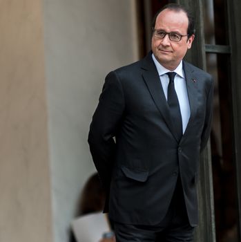 FRANCE, Paris: French President Francois Hollande waits for German Chancellor Angela Merkel and President of European Commission Jean-Claude Juncker at the Elysee palace, in Paris, where takes place a France-Germany digital summit, on October 27, 2015.