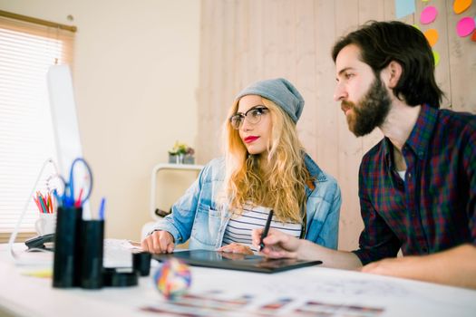 Creative team working at desk in casual office