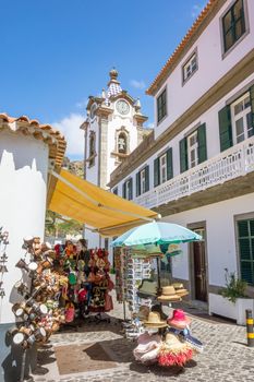 Ribeira Brava, Portugal - June 1, 2013: Village church of Ribeira Brava - view from an alleyway.