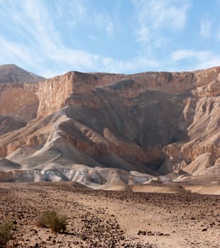 Stone desert tourism hiking in mountains under blue sky