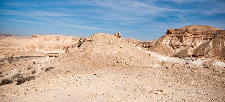 Stone desert tourism hiking in mountains under blue sky