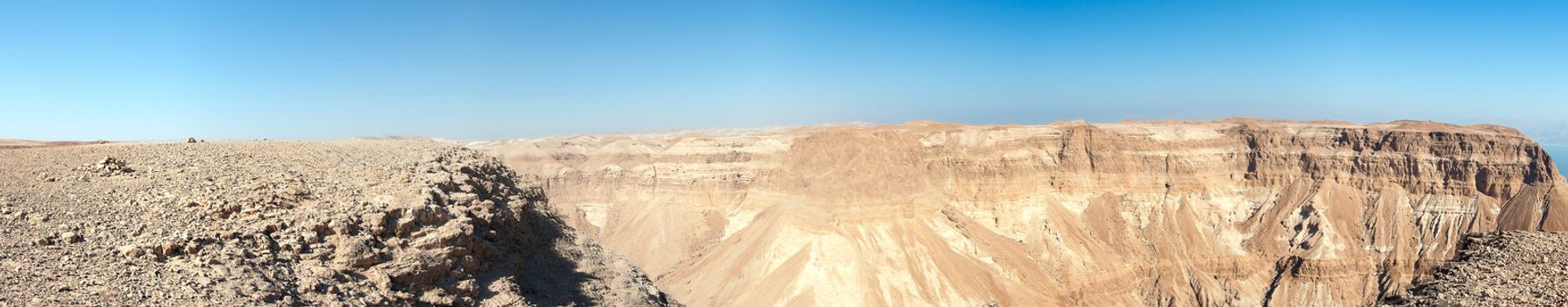 Wide panorama of stone desert mountains in Israel near Dead Sea