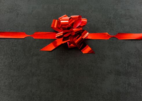 red gift ribbon bow isolated on black
