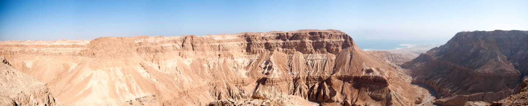 Wide panorama of stone desert mountains in Israel near Dead Sea