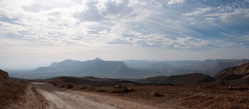 Stone desert tourism hiking in mountains under blue sky