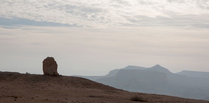 Stone desert tourism hiking in mountains under blue sky