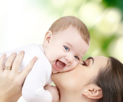 family, child and happiness concept - happy mother with baby