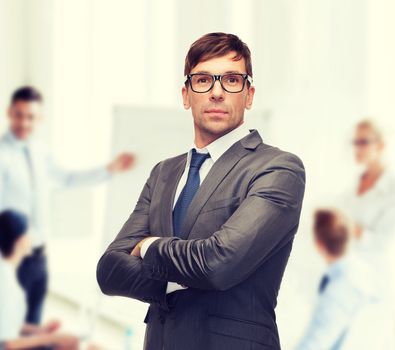 business and office concept - attractive buisnessman or teacher in glasses