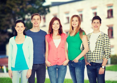 education and people concept - group of smiling students standing