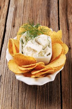 Bowl of corn chips and fresh cheese