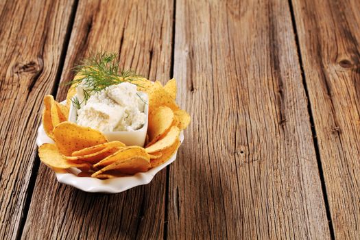 Bowl of corn chips and fresh cheese