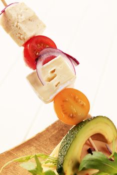 Cheese, tomatoes and avocado on a stick