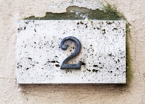 Block number on a weathered wall - detail