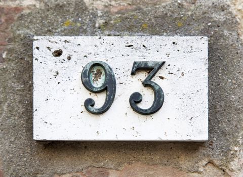 Block number on a weathered wall - detail