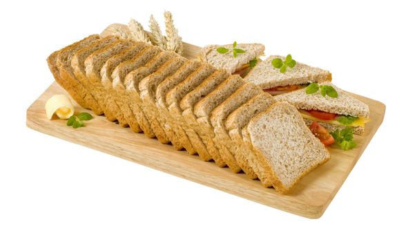 Whole wheat bread and sandwiches on cutting board