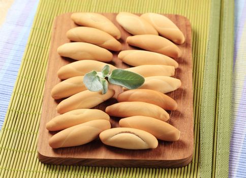 Small white rolls on cutting board