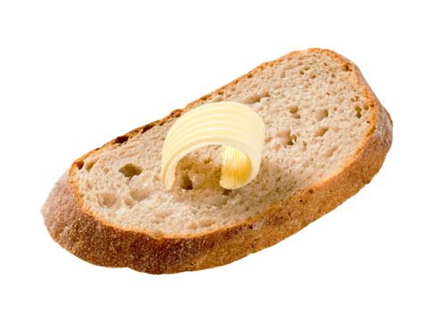 Slice of bread and curl of fresh butter