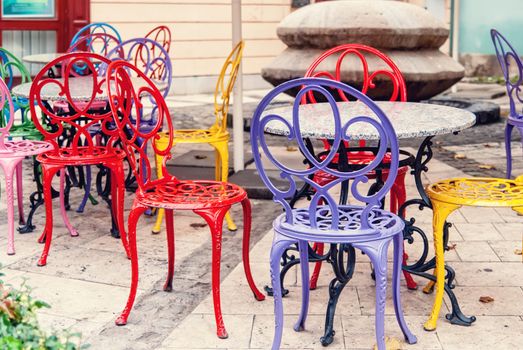 Vintage street Coffee Shop, brightly colored metal chairs