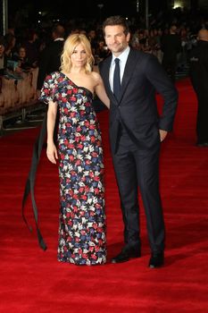 UNITED KINGDOM, London: Sienna Miller and Bradley Cooper attend the European premiere of Burnt at Leicester Square in London on October 28, 2015. 