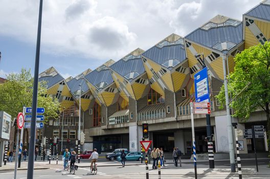 Rotterdam, Netherlands - May 9, 2015: Tourist visit Cube Houses the iconic in the center of the city. Cube Houses are a set of innovative houses built in Rotterdam and Helmond in the Netherlands, designed by architect Piet Blom.