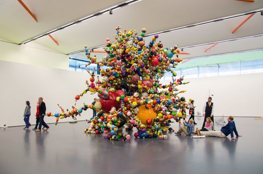 Rotterdam, Netherlands - May 9, 2015: People enjoy exhibition in Kunsthal museum in Museumpark, Rotterdam on May 9, 2015. The building was designed by the Dutch architect Rem Koolhaas.