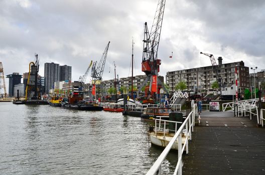 Rotterdam, Netherlands - May 9, 2015: People at Leuvehaven district in Rotterdam, Netherlands. Leuvehaven is Rotterdam's oldest sea port.