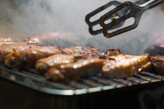 chicken cooked on the grill in smoke
