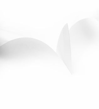 knife blade cuts white paper on a white background
