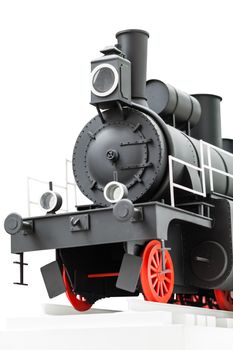 black vintage toy train on the tracks