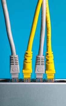 router with wires closeup on a blue background