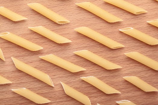raw the pasta closeup on wooden background 
