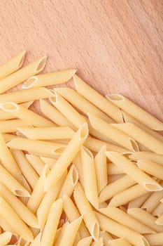 raw the pasta closeup on wooden background 