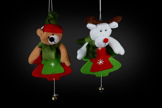 Christmas decorations to hang on the Christmas tree on a black background