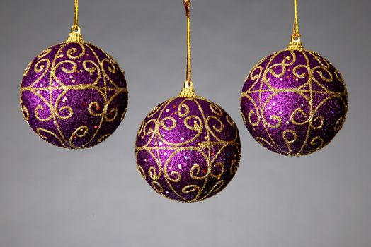 three colorful balls and decorated to hang the Christmas tree to hang on a white backgroun