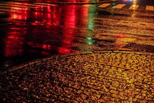 Street ground at night after rain.