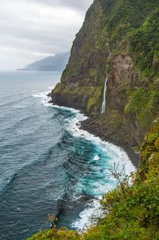 Wild atlantic coast, Island Madeira coastline - impressiv mountain with waterfall - Ponta do Poiso