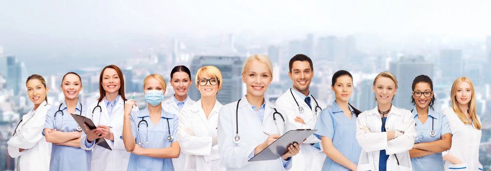 healthcare and medicine concept - smiling female doctors and nurses with stethoscope