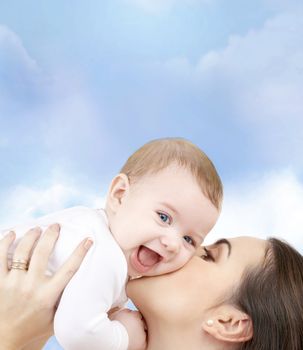 family, child and happiness concept - happy mother with baby